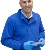 Stephen Beers, in protective gear, smiles broadly