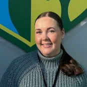 Head and shoulders portrait image of Emma-Louise Doncom smiling at the camera.