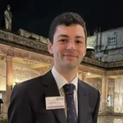 Head and shoulders portrait image of Joseph Futter smiling at the camera.