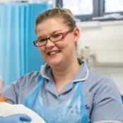 Head and shoulders portrait images of Maria McNeill in her uniform smiling at the camera
