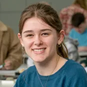 Head and shoulders portrait of Rebecca Jacques smiling at the camera.