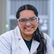 Head and shoulders portrait image of Sneha Shah smiling at the camera.