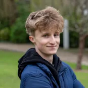 Head and shoulders portrait image of William Baker smiling at the camera.