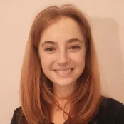 Head and shoulders portrait image of Beth Glover smiling at the camera