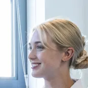 Head and shoulders portrait image of Eleanor Ryan, BSc Occupational Therapy student looking to the left of the camera.