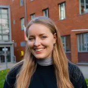 Head and shoulders portrait image of Madison Scrabeck, MSc Maritime Archaeology student smiling at the camera.