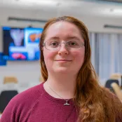 Head and shoulders portrait image of Megan Regensburger, MSc Maritime Archaeology student smiling at the camera.
