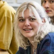 Head and shoulders portrait image of Olivia Harpwood, BA Philosophy with Year Abroad student smiling looking at the camera.