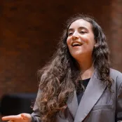 Maria Cristovao Cabacos Martins singing in the Turner Sims hall.