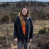 Carla standing in a moorland area