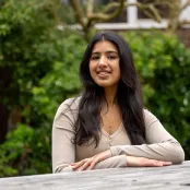 Anushree Sheth sitting outside