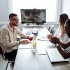 three people in discussion in business meeting room 