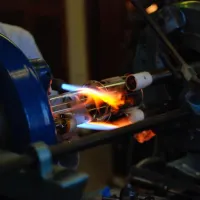 Glassblowing expert creating customised glassware in a workshop