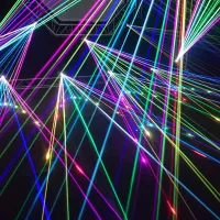 Colourful laser beams intersecting against a dark background.