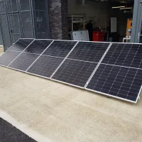 Solar panels on the floor at the entrance of a workshop