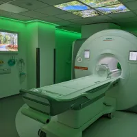 An MRI scanner bathed in green light