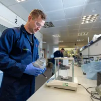 Dan Stewart weighing materials during laboratory research at Viridi.