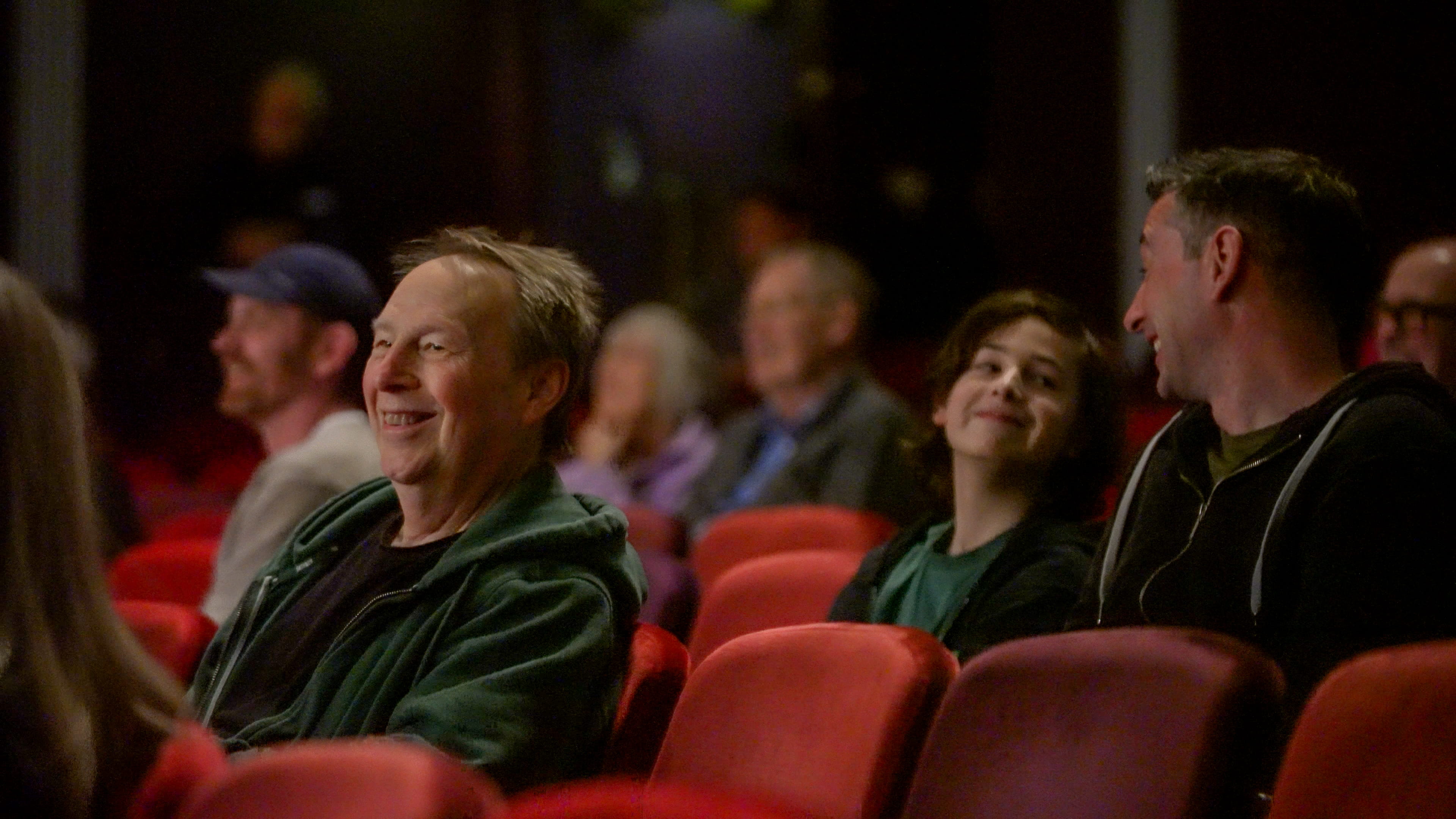 Audience members seated in a theatre during the AI Arts Festival 2026.